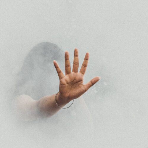 anonymous woman hiding in thick smoke